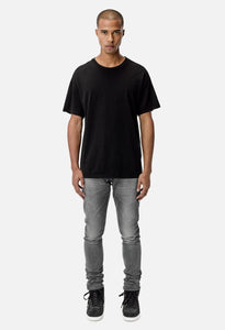JOHN ELLIOTT UNIVERSITY TEE BLACK
